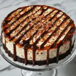 Samoa Cheesecake with Chocolate Crust and Caramel Coconut Topping