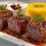 Persian Koofteh Kebab in Tomato Sauce with Golden Kateh Rice