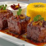 Persian Koofteh Kebab in Tomato Sauce with Golden Kateh Rice