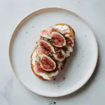 Smashed Croissant with Ricotta, Arugula Pesto, Spicy Salami, Figs, and Fried Zucchini