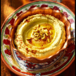 Loaded Layered Hummus Dip with Spiced Beef and Pine Nuts